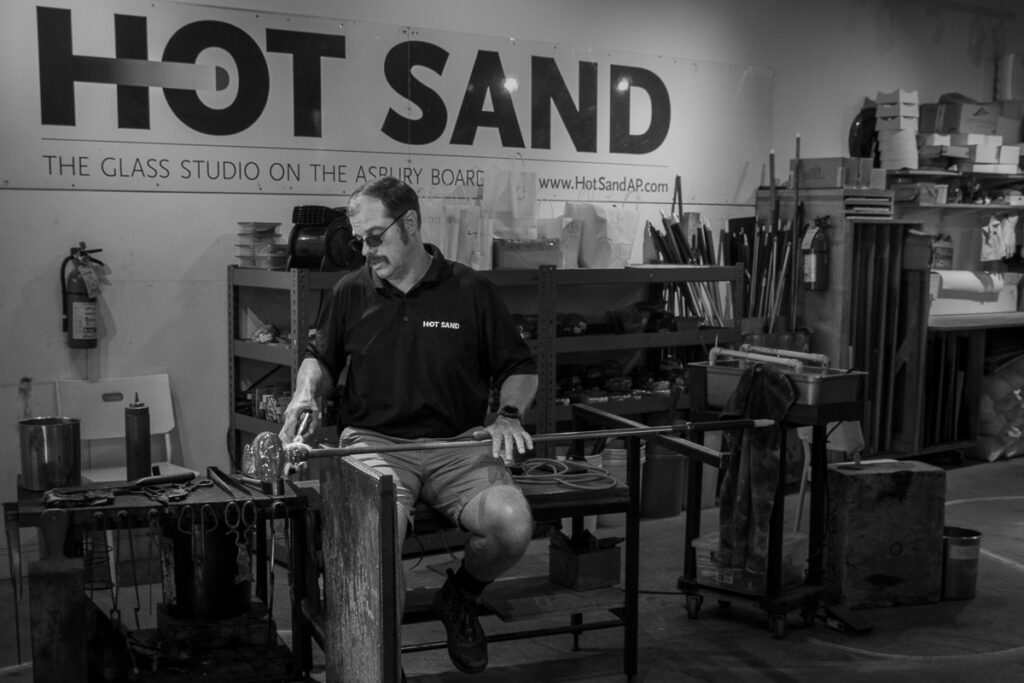 Paul Elyseev is co-founder of Hot Sand glassblowing studio in Asbury Park, NJ. He is photographed here in his studio while creating a piece of art. http://www.hotsandap.com/