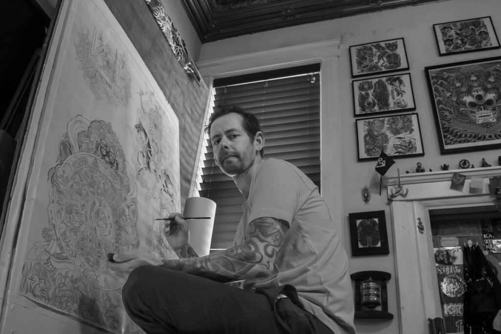 Yoni Zilber is a tattoo artist, painter, and Tibetan Art expert. He is photographed here in his Atlantic Highlands, NJ studio https://www.yoniztattoo.com/